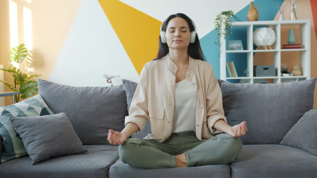 Woman practicing stress reduction techniques for PMDD management